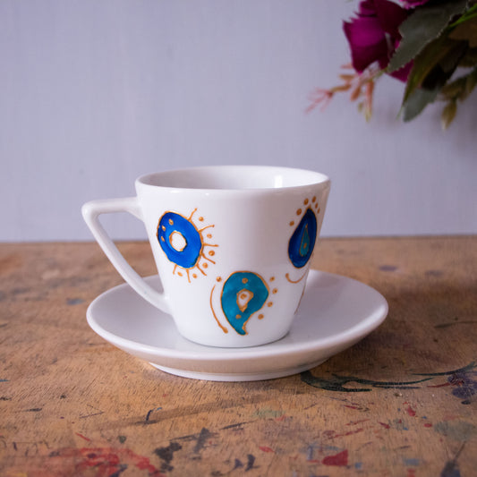 Blue eyes cappuccino and teacup
