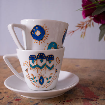 Blue eyes cappuccino and teacup